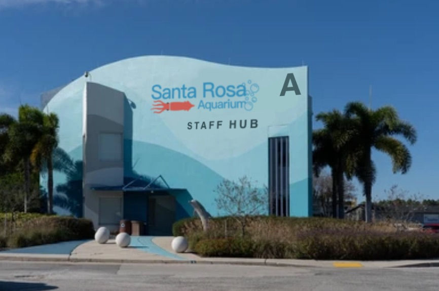A photograph of Sector A of the fictional Santa Rosa Aquarium. In universe, Sector A houses the outdoor entertainments of the facility. Specifically, it houses the infamous dolphin zipline. Credit to SquakProductions.