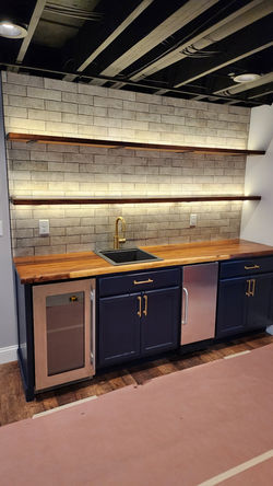 Basement wet bar with under-shelf lighting