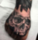 skull hand tattoo