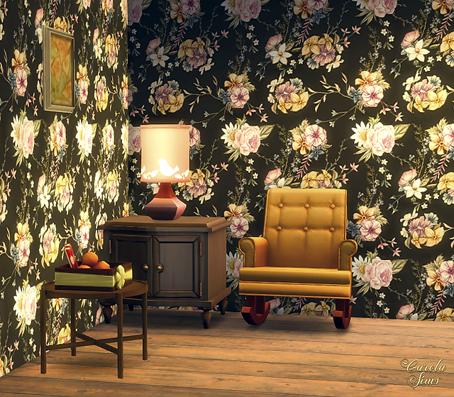 Retro living room with CarolaSims' floral wallpaper, a mustard-color rocking chair, a side table with a lamp, and a bowl of fruits, creating a warm cozy feel.