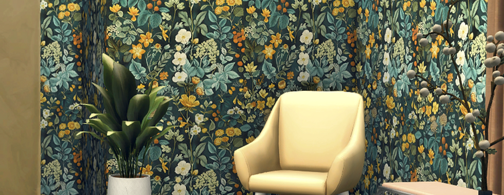 A Sims 4 room setting with a cream chair and potted plant on wooden floor against a vibrant floral wallpaper backdrop. Elegant and cozy setting. The floral wallpaper is from the Wall Pack n4 set by CarolaSims.