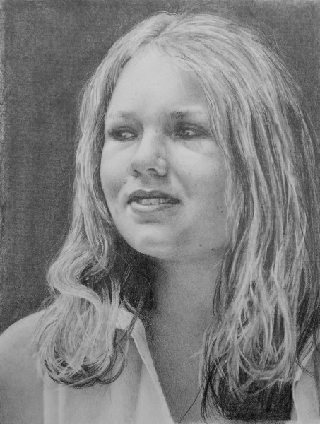 A black and white portrait drawing of a woman with long hair, gazing slightly to the side. She has a serene expression and wears a light top. The portrait is part of a lesson on How to draw a portrait from the online drawing course "Pencil Drawing Made Easy" by Nolan Clark.