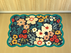 CarolaSims' teal rug on a wooden floor.