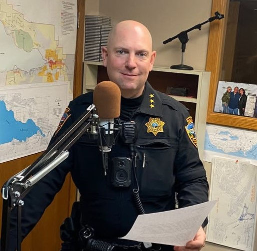 Douglas County Undersheriff Tyler Caille, in the KOZI studios Dec. 2025, offering safe driving public service announcements.