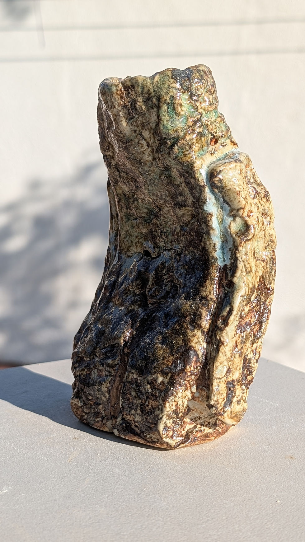Thumbnail: ceramic stoneware sculpture depicting a human figure looking like a rock
