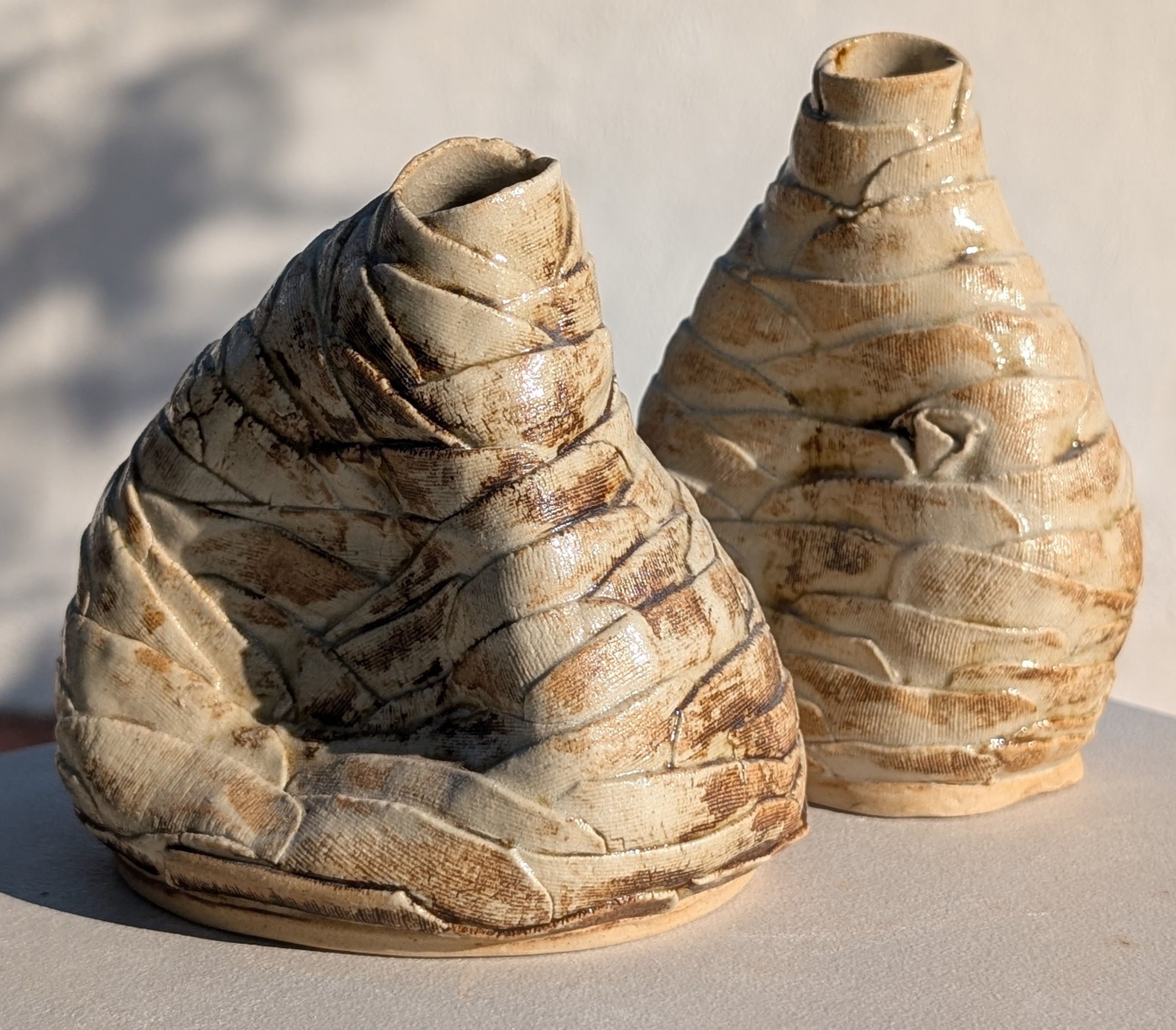 stoneware ceramic vases made of thin layers resembling leather and smashed