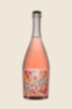 Bottle of Pet Nat, an organic Greek wine with a pink hue.