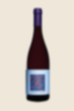 Bottle of red organic Greek wine with a blue patterned label