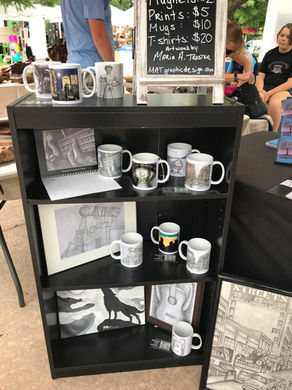 Original artwork and printed art items on display at the 918 Makers Market