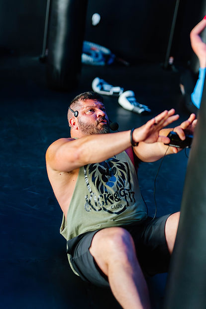 Trainer leading sit-ups