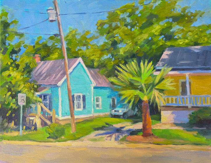 An impressionist oil painting of a sunny neighborhood street in a small North Carolina town featuring a turquoise house, a yellow house, and a palm tree under a clear blue sky, titled Sunny Day at S. Moore St by artist Yana Slutskaya.