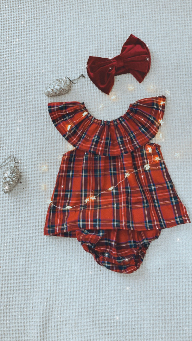 Thumbnail: A handmade baby girl red tartan dress with frill sleeves. The dress falls just below the knee. The perfect flower girl, birthday dress or Christmas party dress. The perfect 1st Christmas dress