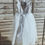 Thumbnail: A handmade grey tutu dress with a heart cut out back and has sparkly grey ankle length tulle skirt. It features a grey ribbon bow sash. Perfect flower girl or Holy communion dress