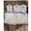 Thumbnail: A handmade ivory white tutu dress with a heart cut out back. It features a sparkly tulle skirt that falls knee length, and has a large duchess satin bow sash. The perfect flower girl, birthday dress or Christmas party dress
