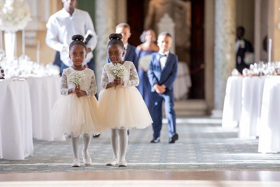 Thumbnail: A handmade ivory white lace tutu dress which features a plain back and long sheer lace sleeves. The soft champagne tutu skirt is knee length and has a large duchess satin bow sash.. The perfect flower girl, birthday dress or Christmas party dress. Perfect Holy Communion dress