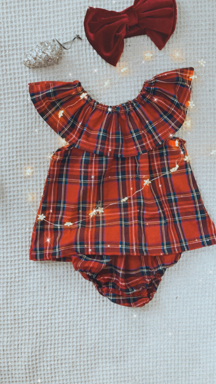 Thumbnail: A handmade baby girl red tartan dress with frill sleeves. The dress falls just below the knee. The perfect flower girl, birthday dress or Christmas party dress. The perfect 1st Christmas dress