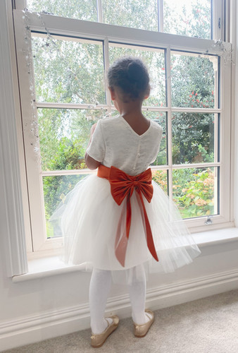 Lace Pearl button back with a burnt orange bow sash flower girl dress