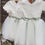 Thumbnail: A handmade ivory white lace  tutu dress with a V pearl button back. It features a soft ivory white tulle skirt that falls knee length and a sage ribbon bow sash. The perfect flower girl, birthday dress or Christmas party dress