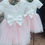 Thumbnail: A handmade white ivory velvet top with cap sleeves and a large velvet bow tutu dress. It features a soft pink tulle skirt that falls to the knee the perfect flower girl or birthday dress