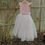 Thumbnail: A handmade small frill sleeve blush pink tutu dress with a heart cut out back and a large duchess satin bow sash. It features a sparkly tulle skirt that falls to the ankle the perfect flower girl or birthday dress