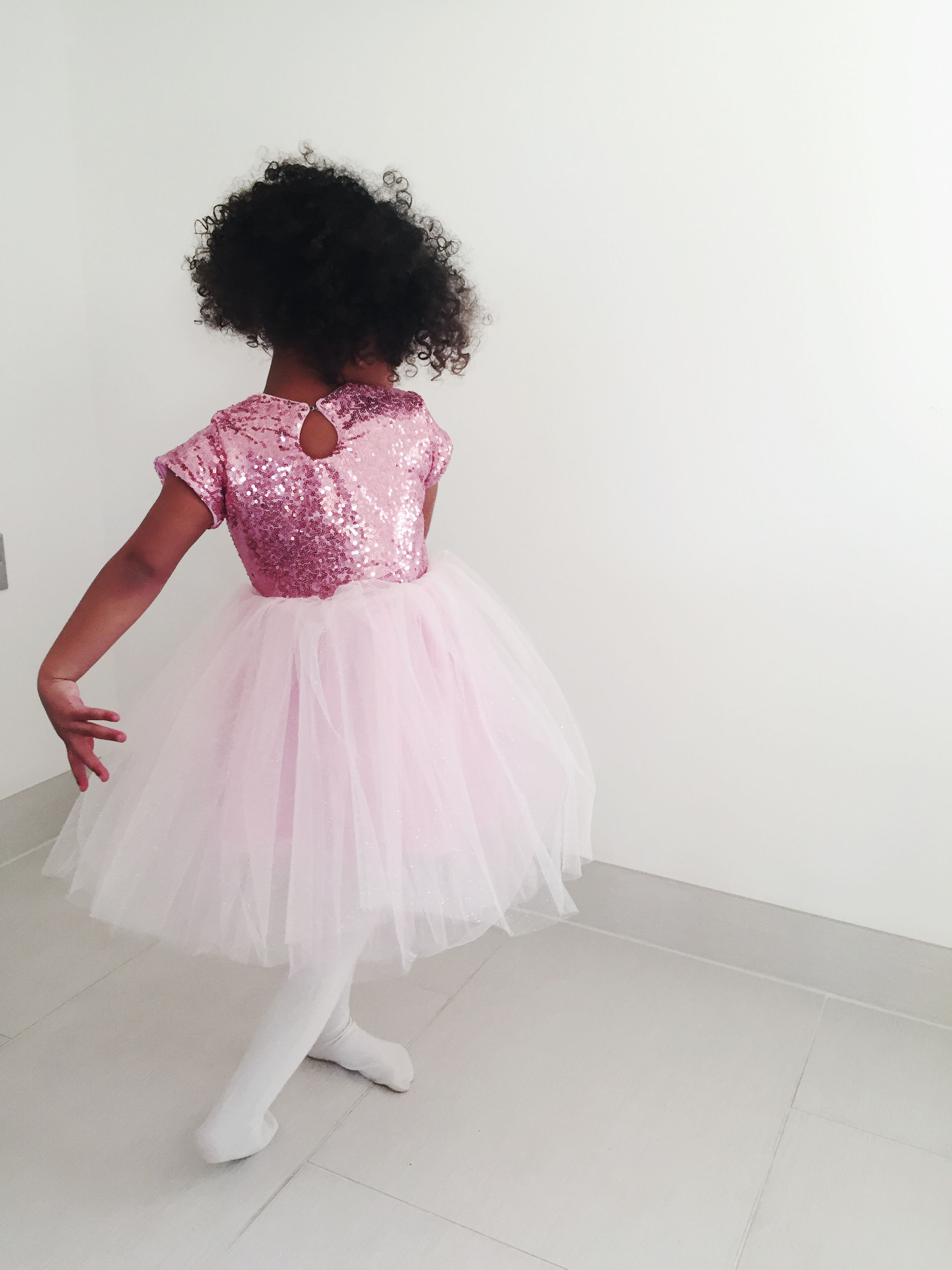 A handmade pink sequin sparkly tutu dress. It has a pink sequin top with cap sleeves and a sparkly pink tutu skirt that falls to the knee. The perfect handmade flower girl dress. Girls Christmas dress winter baby girl flower girl dress Girls birthday tutu dress