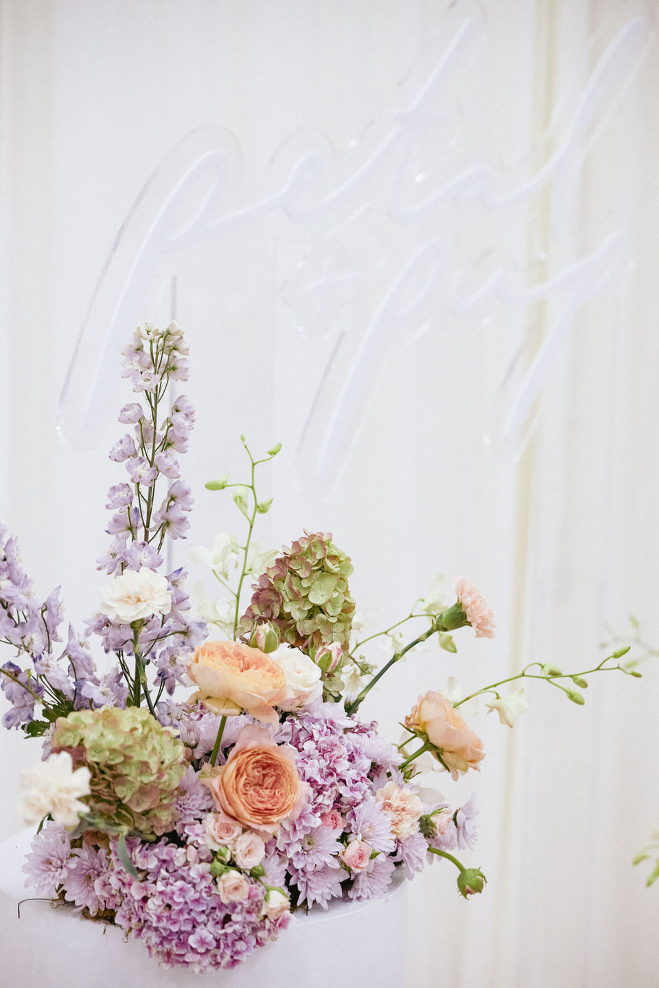 Whimsical and sculptural purple, blush and sage floral plinth arrangement with Hydrangea flowers for Petal and Pup International Women's Day flowers luncheon event