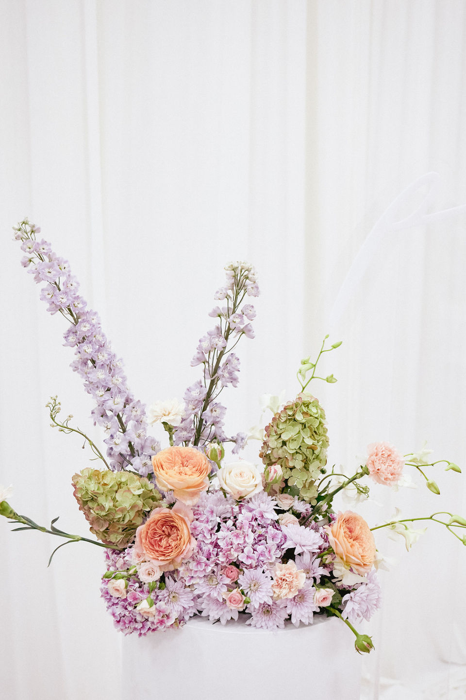 Whimsical and sculptural purple, blush and sage floral plinth arrangement with Hydrangea flowers for Petal and Pup International Women's Day flowers luncheon event