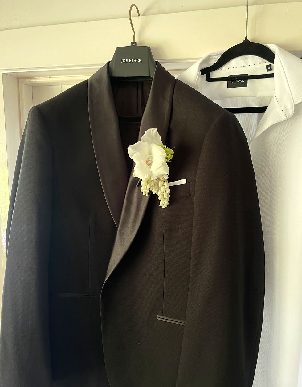 Buttonhole consisted of Gladioli, green lisianthus bud and trailing andromeda for Groom