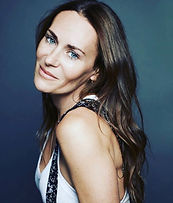 Laetitia Cash headshot blue background portrait by Andrea Carter-Bowman photography