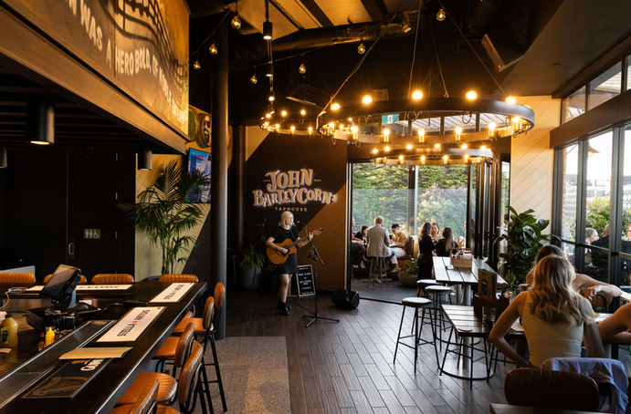 Inside John Barleycorn’s Taphouse Newmarket with live music creating a vibrant atmosphere at one of Newmarket’s top pubs and rooftop bars.
