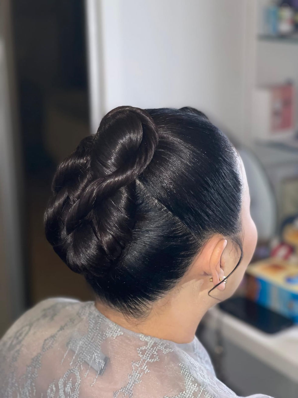 Elegant dark hair styled in an intricate bun
