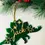 Thumbnail: Personalised Dinosaur Christmas Bauble Green & Gold Acrylic