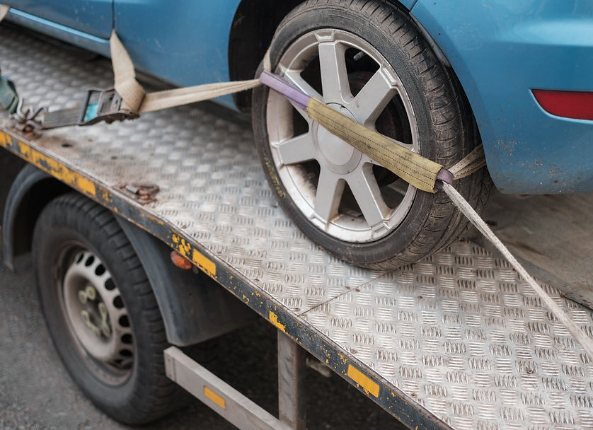 A Car Being Towed After A Parking Violation Or Breakdown.jpg