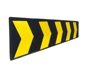 A long, black rubber wall protector with yellow and black striped patterns. This type of protector is designed to be installed along the walls of a domestic garage or similar indoor space, helping to absorb impacts and prevent damage to the walls from vehicles or equipment.