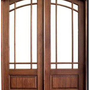 Double mahogany doors create a grand entrance