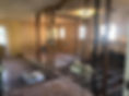 Before renovation, the Charleston, South Carolina kitchen during demolition with the original walls, flooring, plumbing, and electrical systems removed for the full home redesign by Zen Reno & Design.