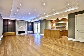 Custom fireplace built-ins with illuminated shelves and tailored millwork