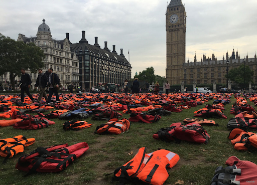 Life jackets outside the houses of parliament to represent people who have died trying to get to the UK across the Channel