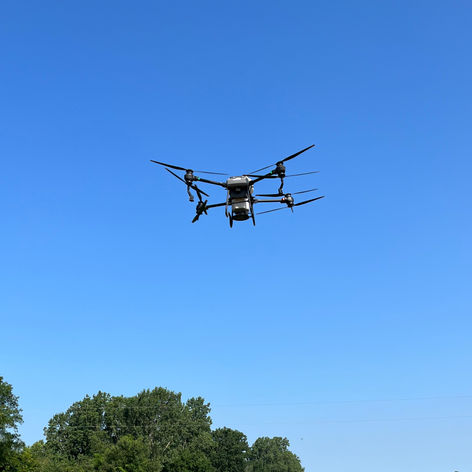 A large drone flying through the air.