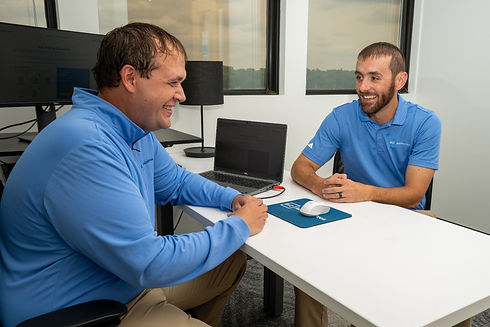 Jacob and Tyler Yates of Biz AccountPros at a desk