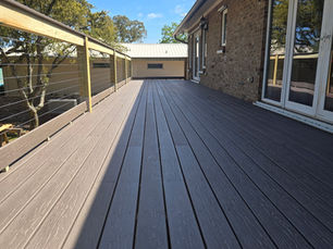 Deck construction in Fort Walton Beach FL showing waterfront residential deck build with wood framing and railing