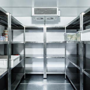 Commercial refrigeration technician servicing restaurant cooling equipment in Pensacola FL