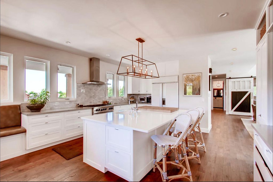 custom kitchen island quartz countertop undermount sink white shaker style kitchen cabinetry Denver