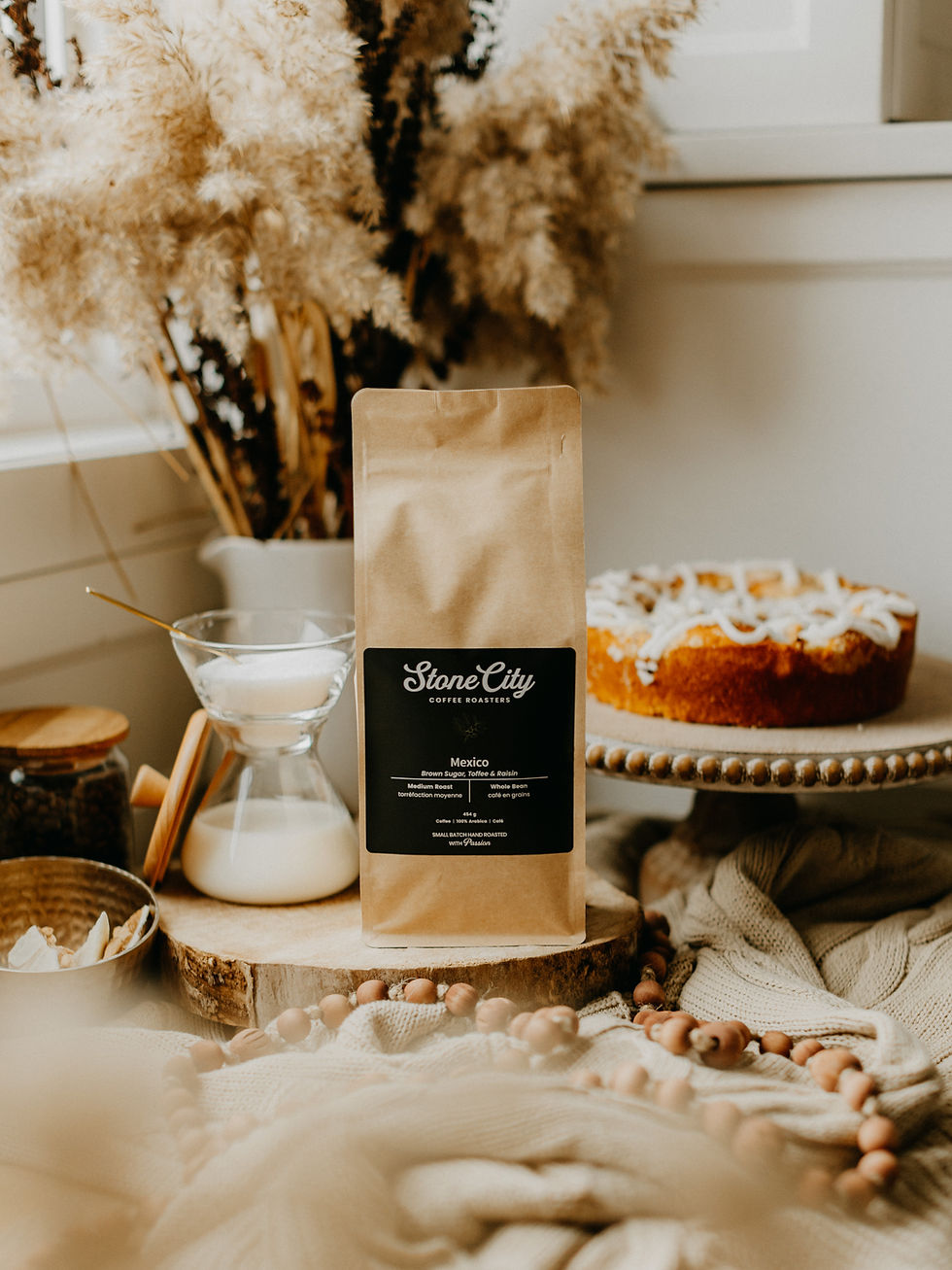 bag of coffee, creamer and cake