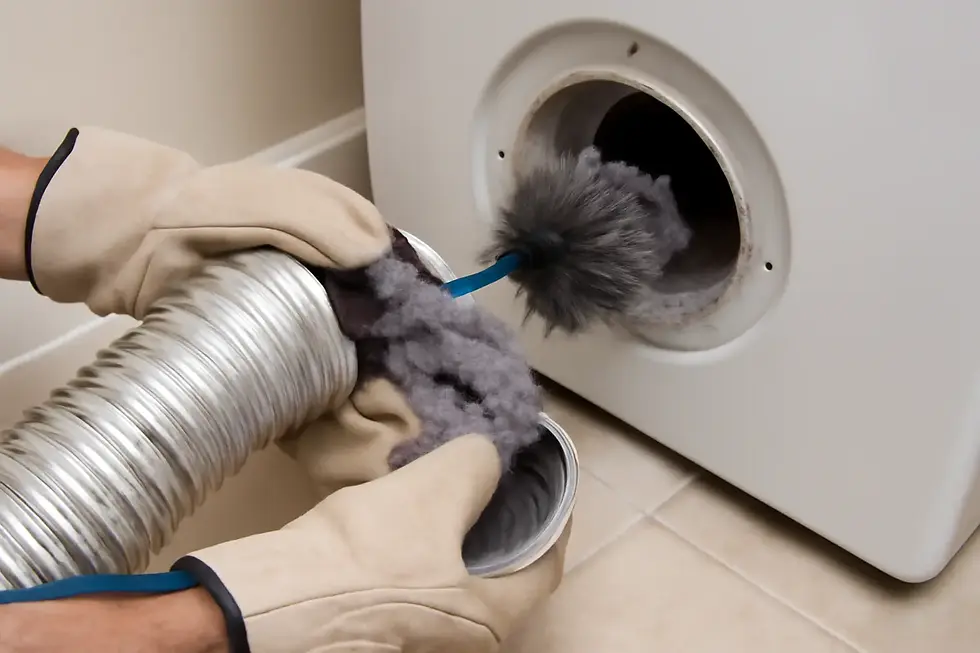 Close-up of gloved hands cleaning lint from a dryer vent hose