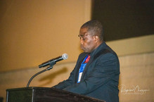 Rev. Kenneth Calvert leading the invocation