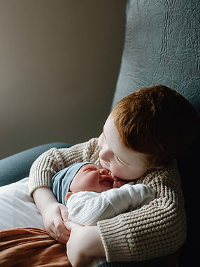 Big brother holding his baby brother