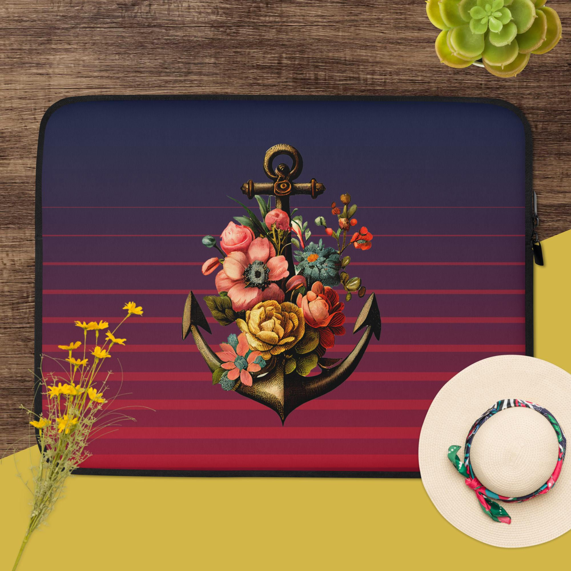 Nautical-themed laptop sleeve with a floral anchor design.