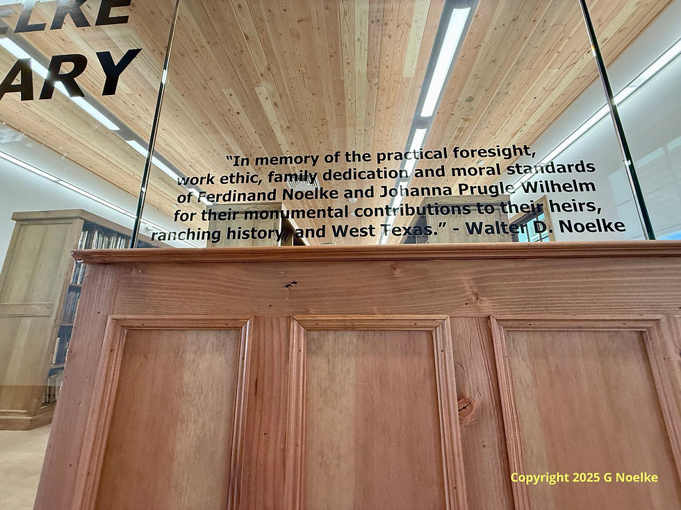 Photo of a glass pane at the Noelke Library with a quote by Walter Noelke dedicating the library to Ferdinand Noelke and Johanna Prugle Wilhelm.