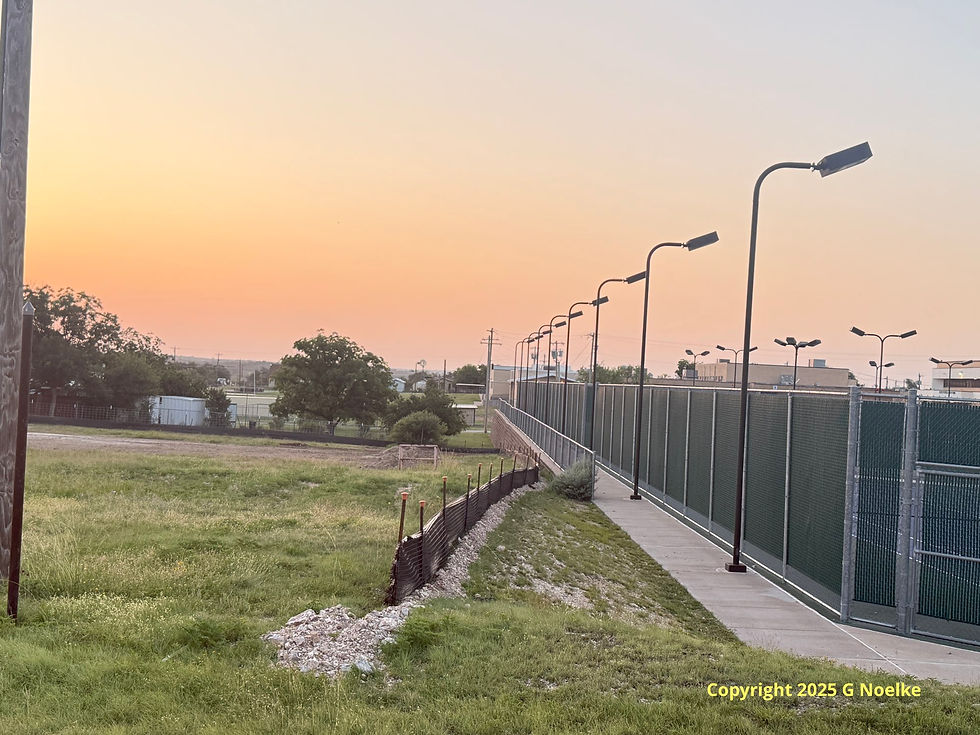 The installation of this erosion fence around where the new transportation facility will be is a non event to most in the community. In fact, it speaks volumes...like a SWPPP is forthcoming, like elevations and water flow directions and like another City of Mertzon alley is potentially being gobbled up. This City alley is immediately adjacent (north) of the IC ISD tennis courts. That is, the alley runs parallel to this sidewalk and retaining wall and extends to the left of that about 18-20 feet.